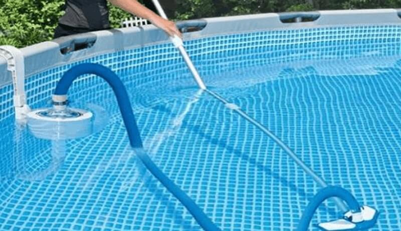 how to vacuum above ground pool